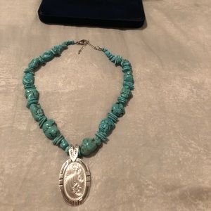 Turquoise stone and silver pendant necklace